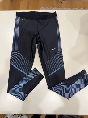 Nike Black Leggings with Light Blue Curved Stripe Accents